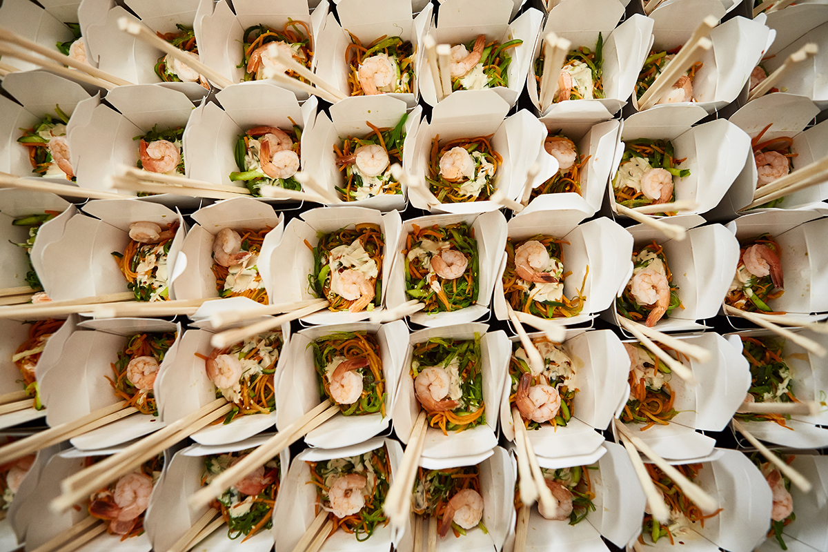 top view of white boxes with asian food